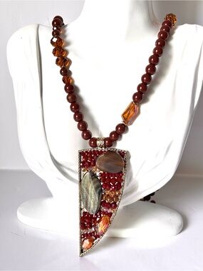 Complex triangular pendant necklace adorned with carnelian and agate
